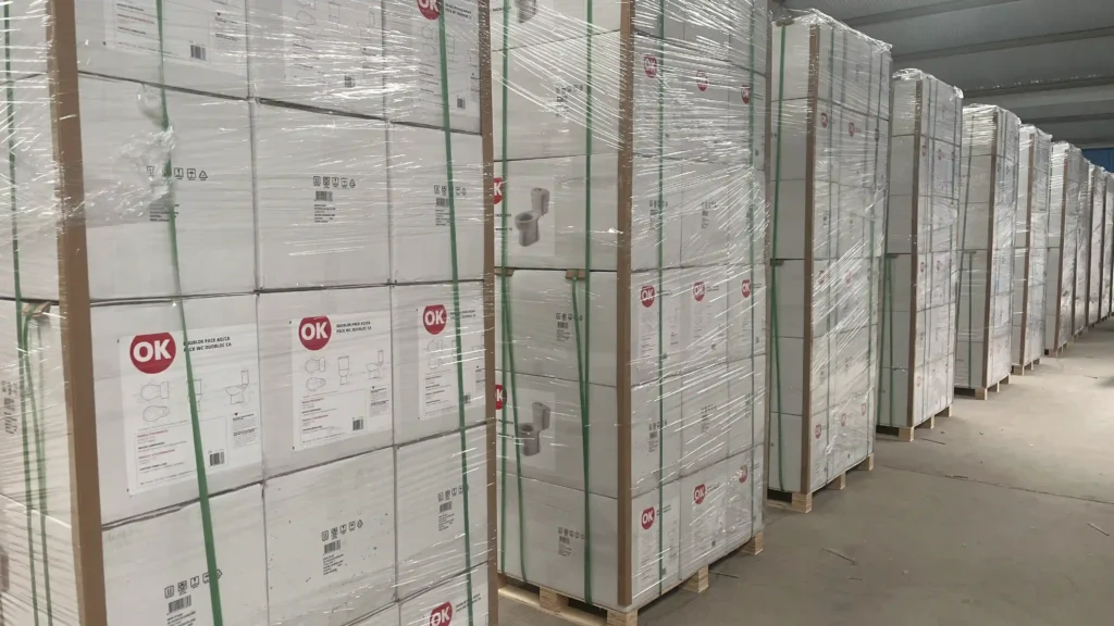 Securely packaged and palletized ceramic toilets ready for shipping